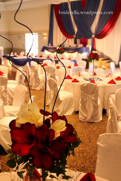  pins prop up this floral arrangement red white blue wedding centerpiece