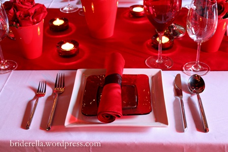 A modern red and white table setting